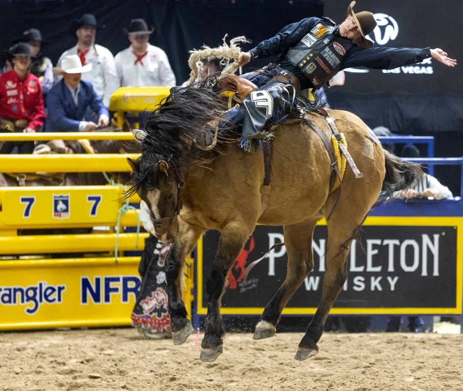 Zeke Thurston competes in the saddle bronc riding event during opening night of the National Fi ...