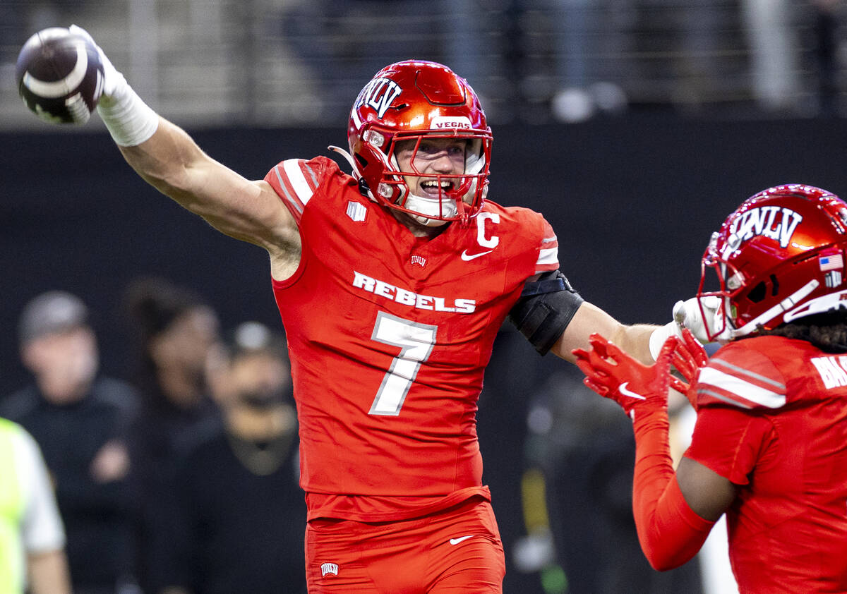 UNLV linebacker Jackson Woodard (7) celebrates after scooping a fumble and scoring a touchdown ...