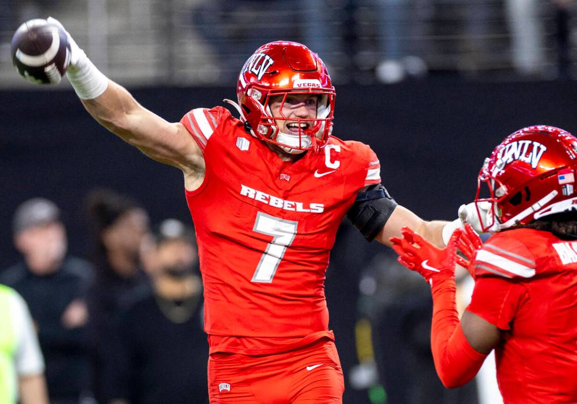 UNLV linebacker Jackson Woodard (7) celebrates after scooping a fumble and scoring a touchdown ...