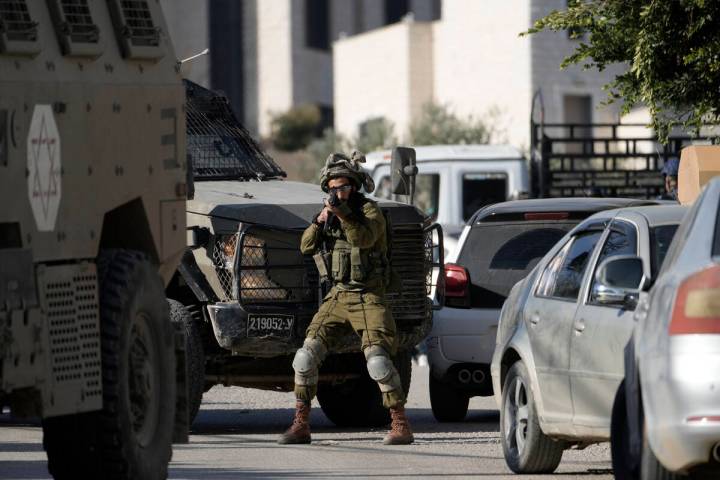 Israeli troops enter the complex of the Turkish hospital, where they searched for the bodies of ...