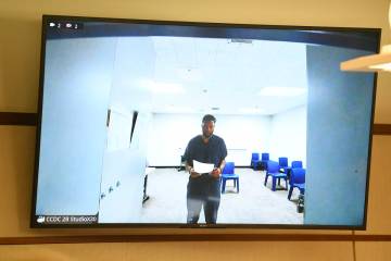 Antwone Washington appears on a monitor while being arraigned in Henderson Justice Court on chi ...