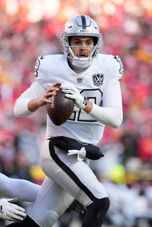 Las Vegas Raiders quarterback Aidan O'Connell looks to pass against the Kansas City Chiefs Frid ...