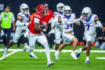 UNLV quarterback Hajj-Malik Williams (6) breaks free for a long run as Boise State Broncos corn ...