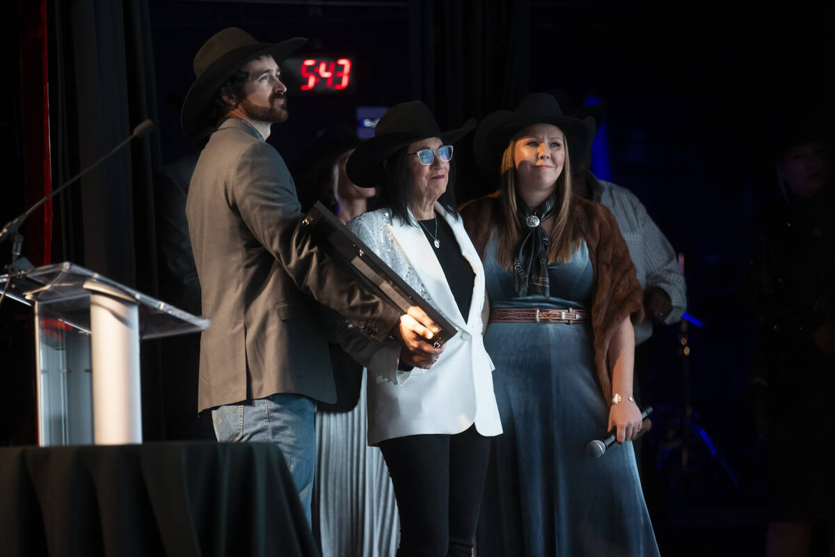 Judy Wagner, center, watches a surprise song that was recorded following the premier of documen ...