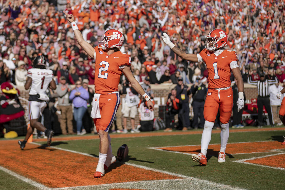 Clemson quarterback Cade Klubnik (2) celebrates his touchdown with wide receiver T.J. Moore (1) ...