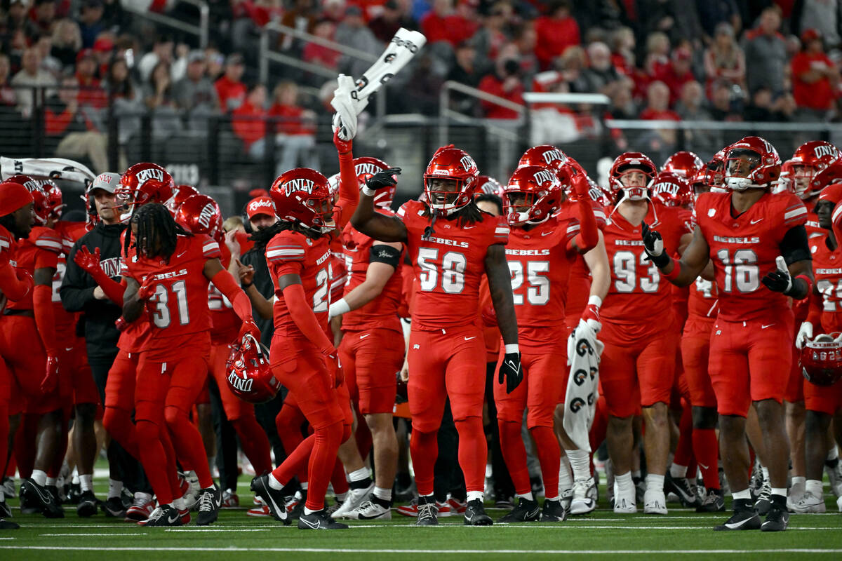 UNLV cheer during a timeout during the second half of an NCAA college football game against Nev ...