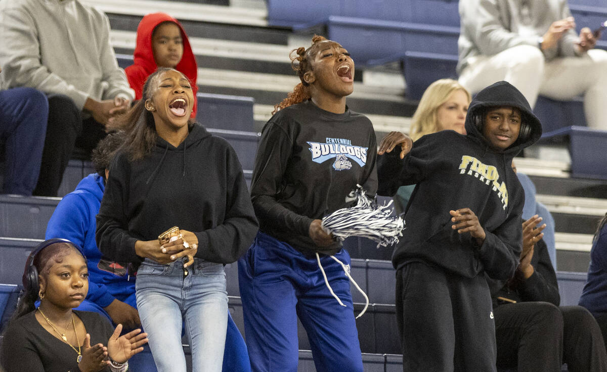 Centennial fans cheer during the high school girls basketball game against Clark at Centennial ...