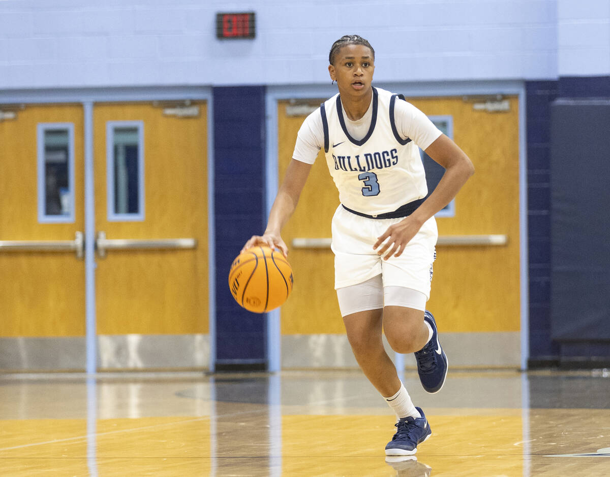 Centennial freshman D'arrah Mitchell (3) controls the ball during the high school girls basketb ...