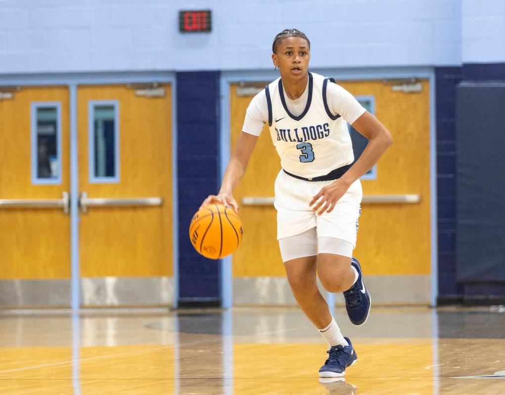 Centennial freshman D'arrah Mitchell (3) controls the ball during the high school girls basketb ...