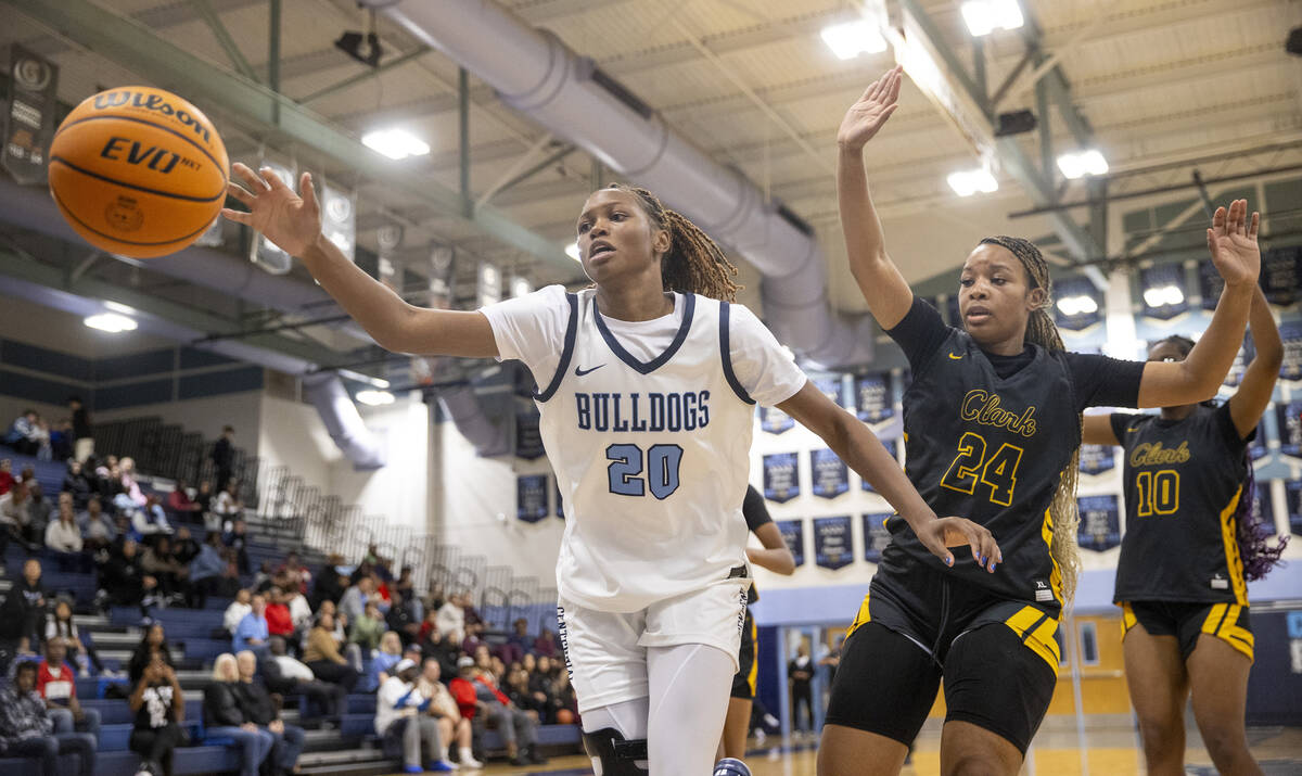 Centennial junior Inieye Oruh (20) reaches for the ball during the high school girls basketball ...