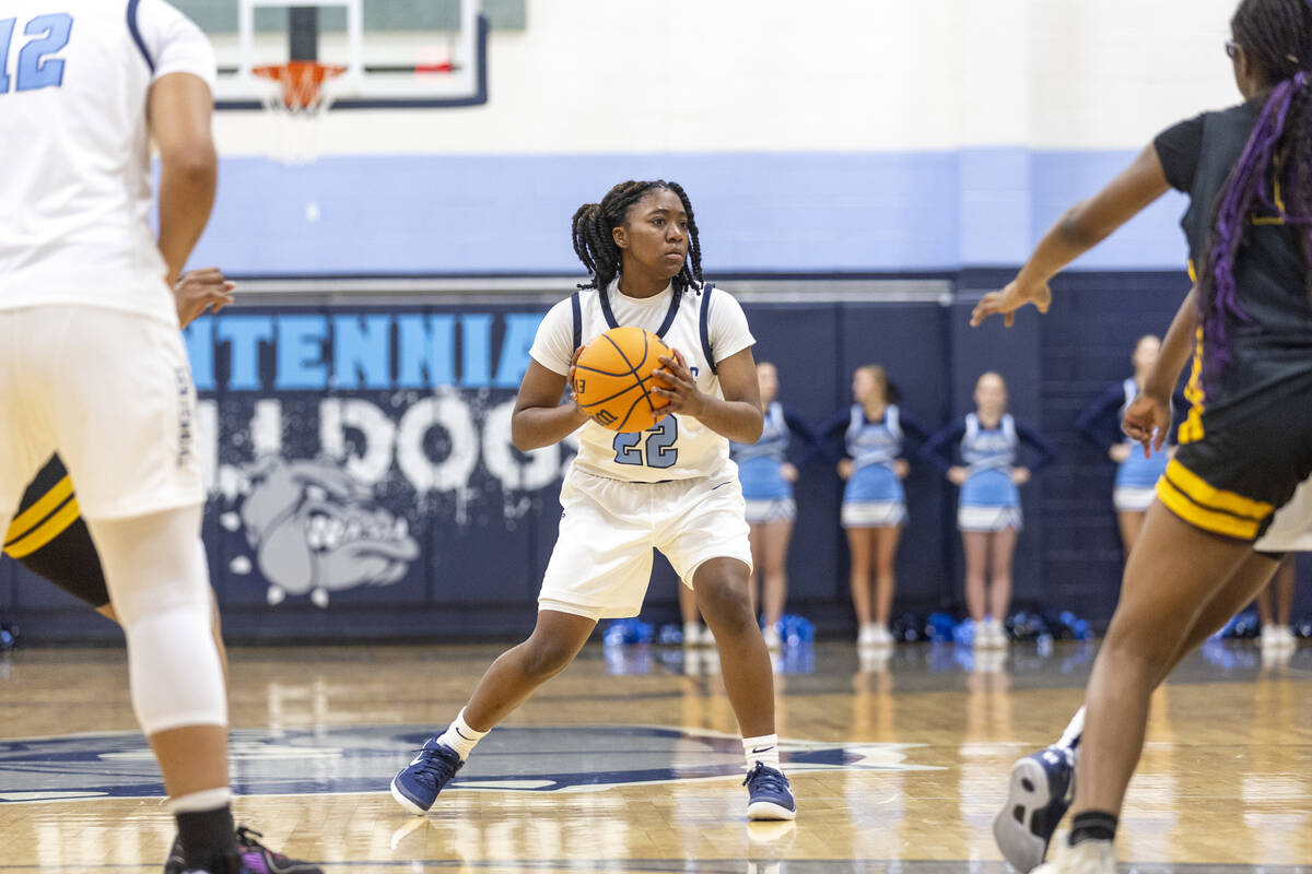 Centennial freshman Peyton Bension (22) looks to pass the ball during the high school girls bas ...