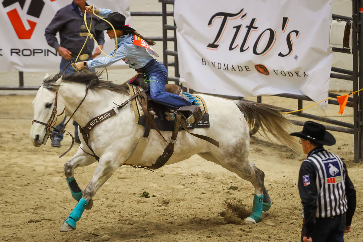 Breakaway roper Rickie Fanning chases a calf out of the chute during the final day of the Natio ...