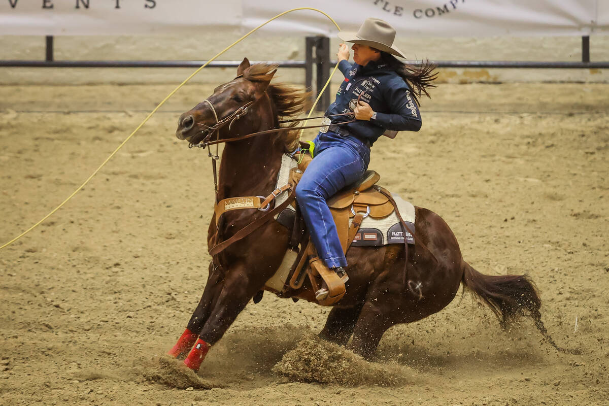 Kelsie Domer ropes a calf during the final day of the National Finals Breakaway Roping event at ...