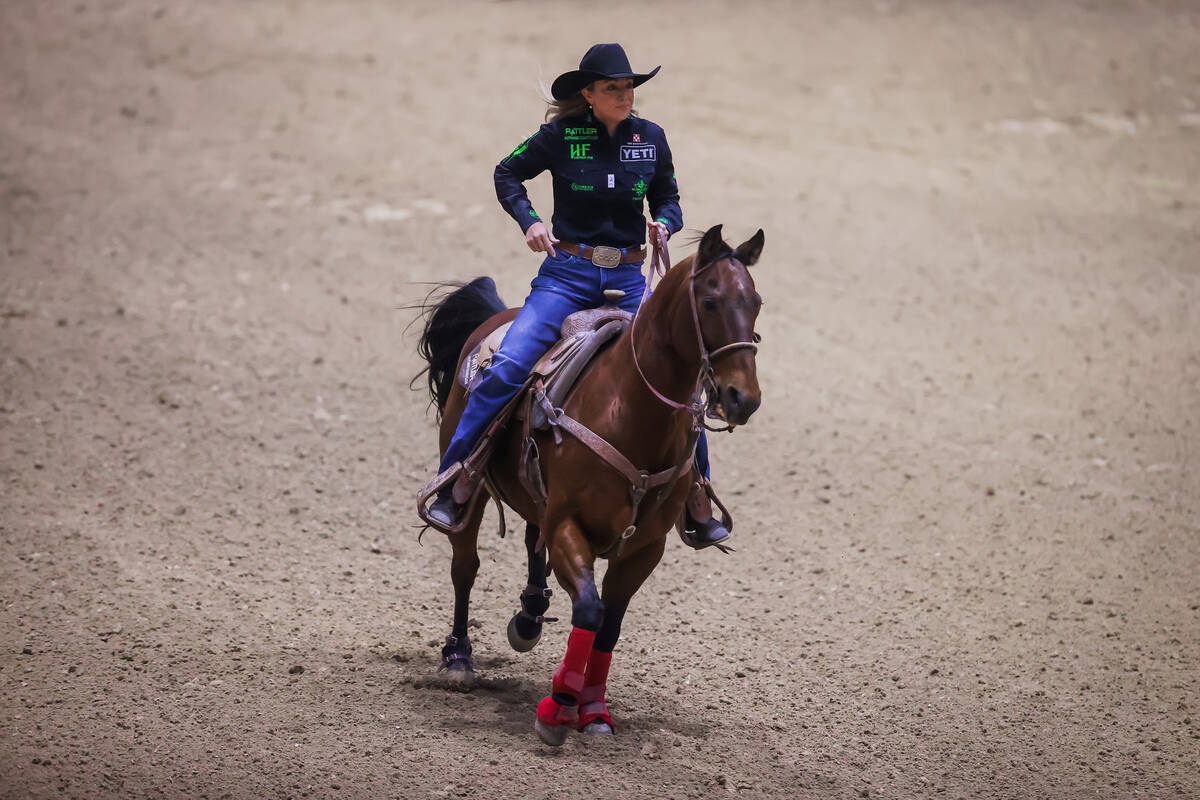 Breakaway roper Jordan Jo Hollabaugh rides off the dirt during the final day of the National Fi ...