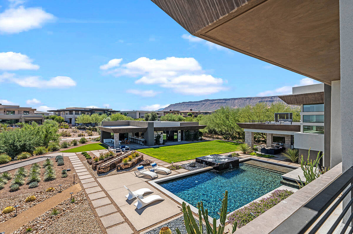 The Summerlin property includes a 1,800-square-foot guest house, pool and spa with fountains an ...