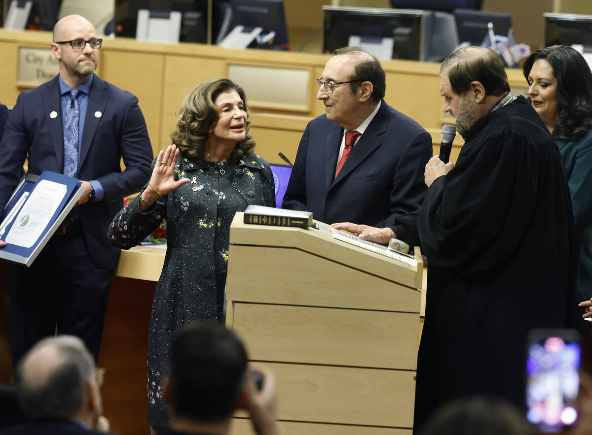 Mayor Shelley Berkley, second left, sworn in as the newest mayor of Las Vegas by Ret. Nevada Su ...