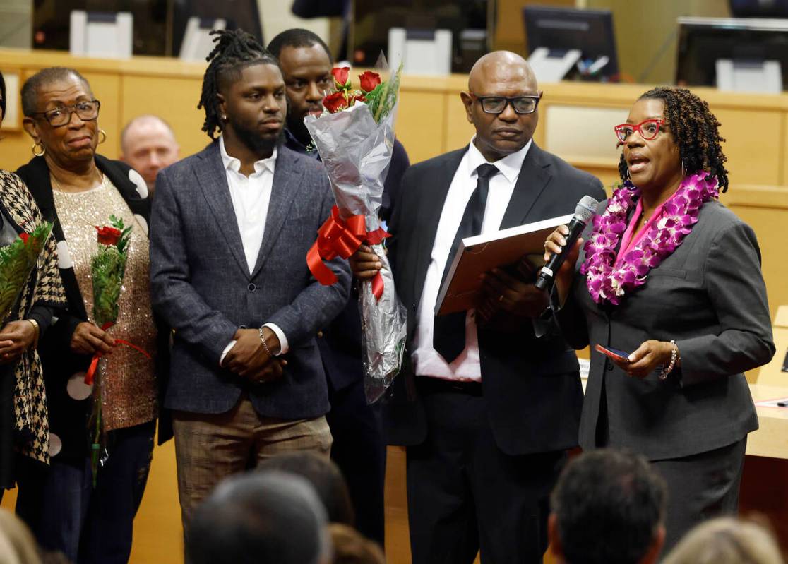 Councilwoman Shondra Summers-Armstrong speaks after being sworn in as (left to right) her mothe ...