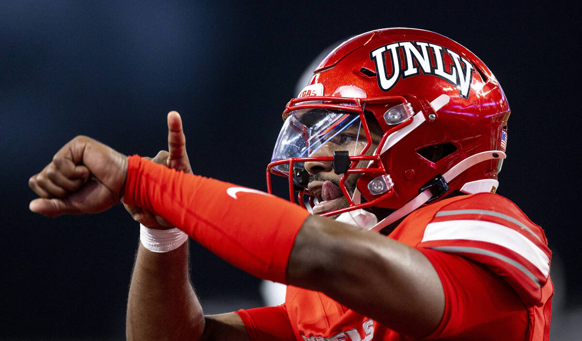 UNLV quarterback Hajj-Malik Williams (6) taps his wrist after scoring a touchdown during the NC ...