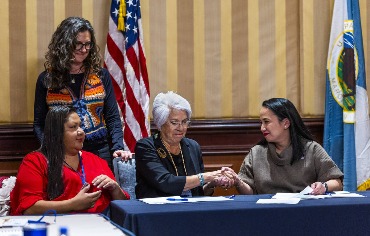 Colorado River Indian Tribal Council Chairwoman Amelia Flores, center, shakes hands with curren ...