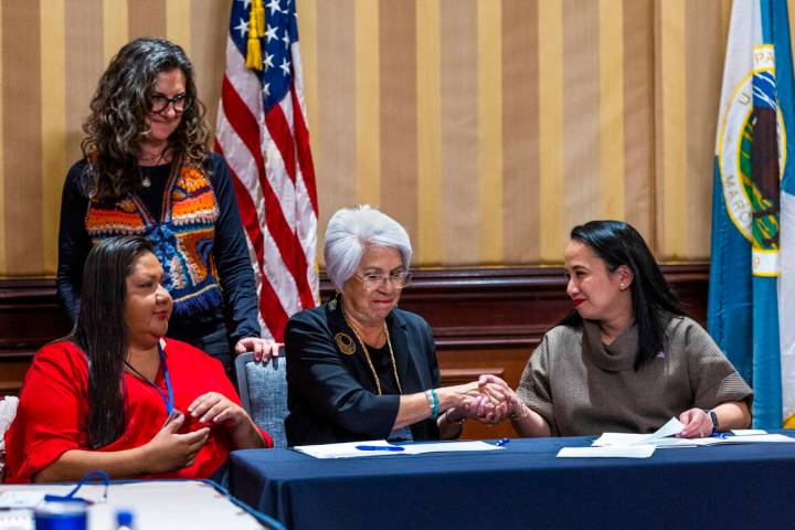 Colorado River Indian Tribal Council Chairwoman Amelia Flores, center, shakes hands with curren ...