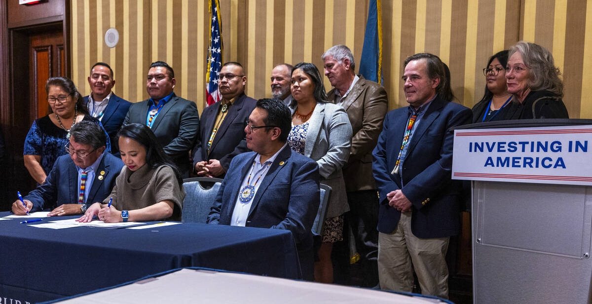 Ute Mountain Ute Chairman Manuel Heart, left, signs document with current Bureau of Reclamation ...