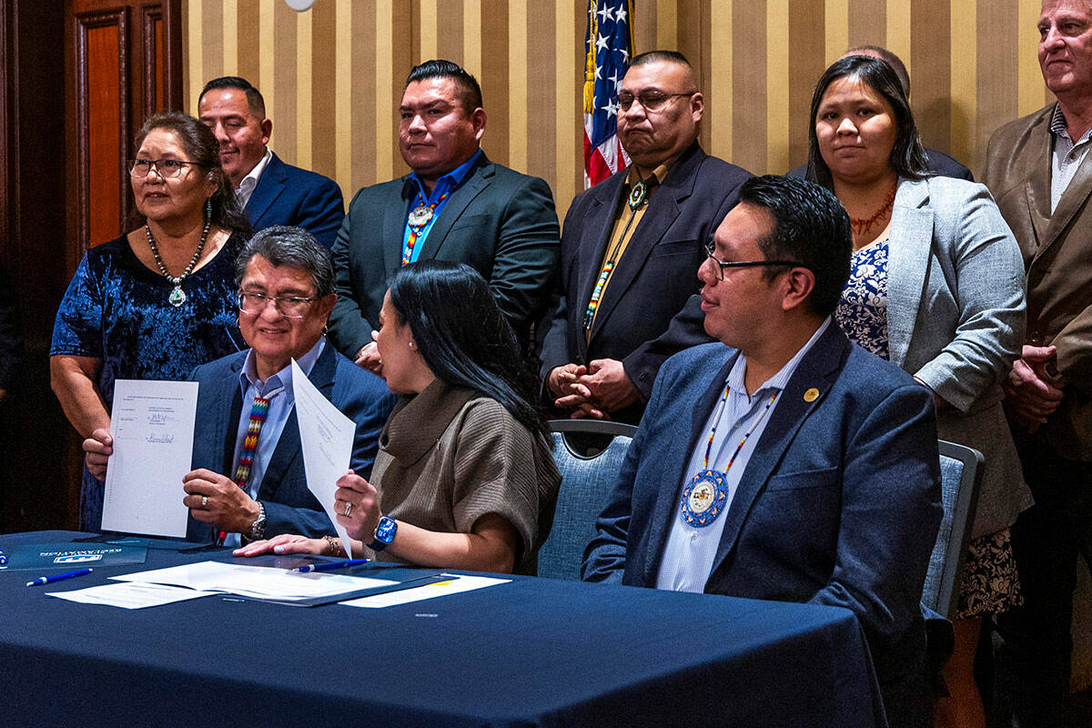 Ute Mountain Ute Chairman Manuel Heart, left, holds up a document with current Bureau of Reclam ...