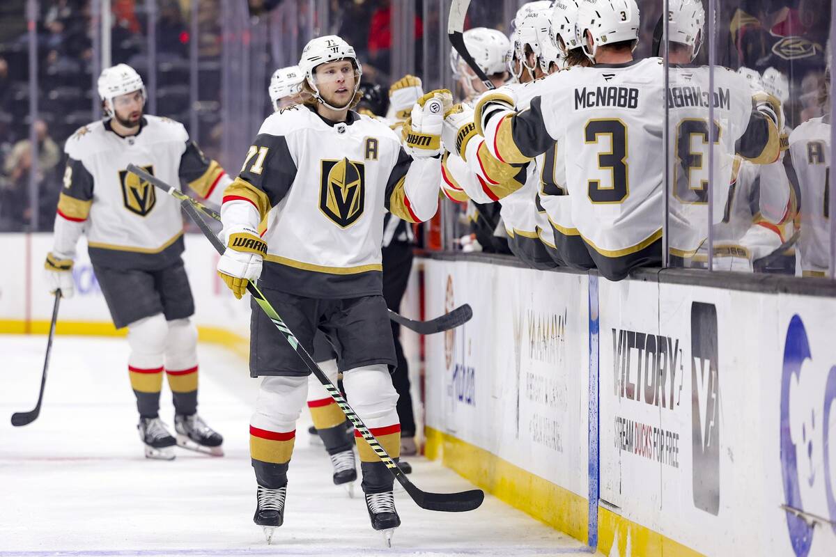 Vegas Golden Knights center William Karlsson celebrates with the bench after scoring during the ...