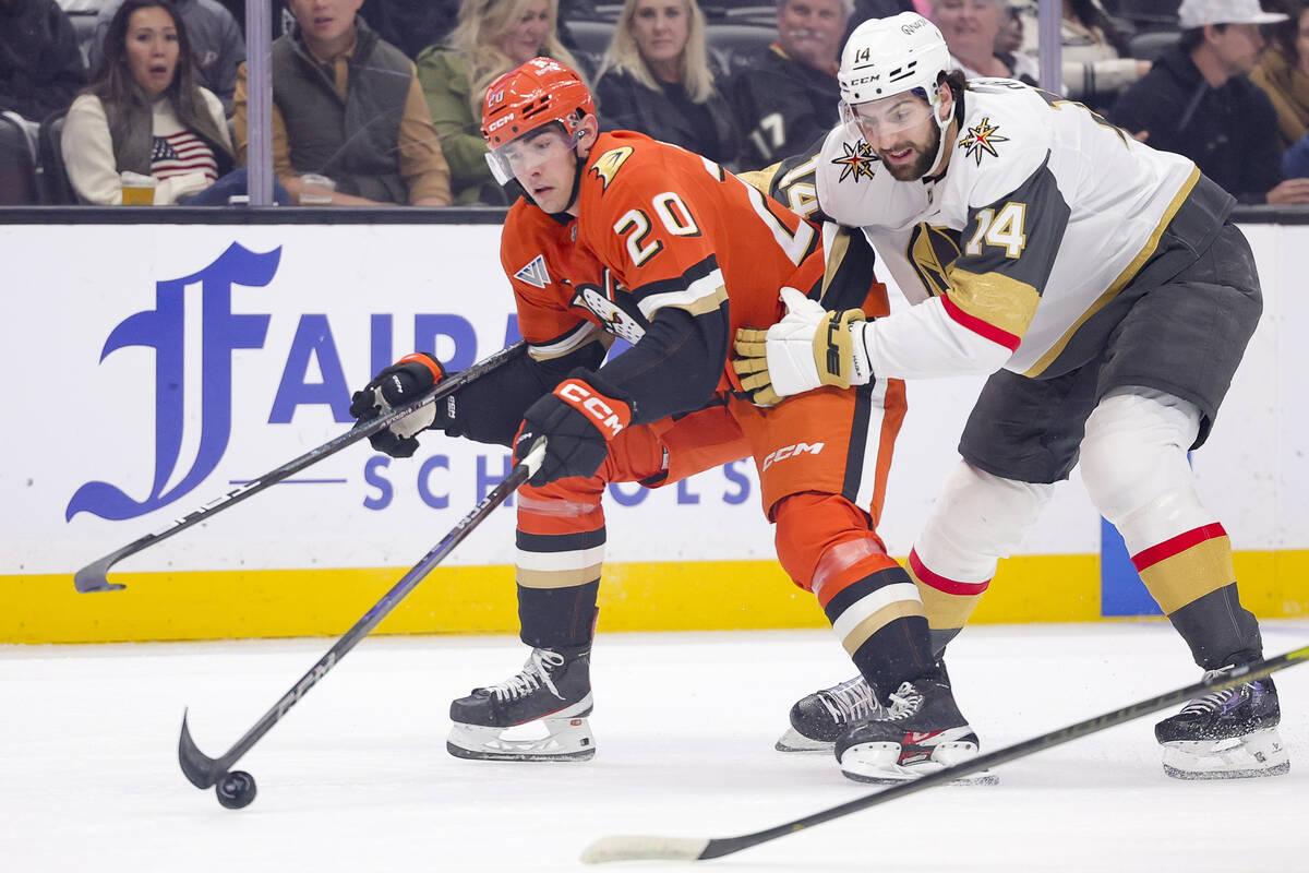 Anaheim Ducks right wing Brett Leason, left, vies for the puck against Vegas Golden Knights def ...