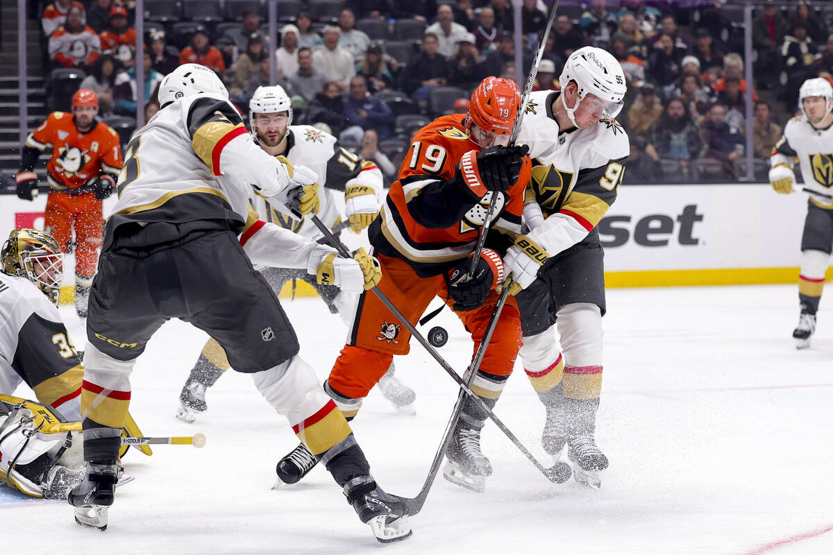 Anaheim Ducks right wing Troy Terry (19) vies for the puck against Vegas Golden Knights defense ...