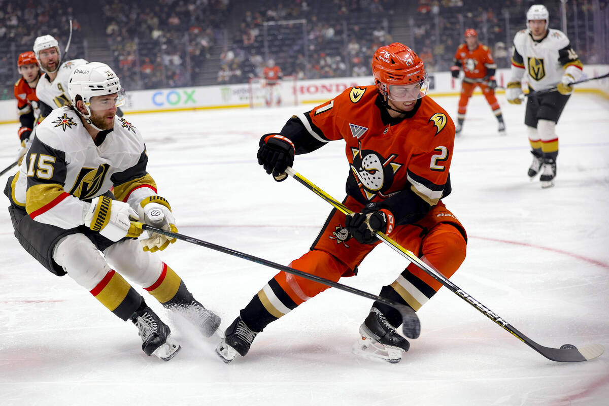 Anaheim Ducks center Isac Lundestrom, right, vies for the puck against Vegas Golden Knights def ...