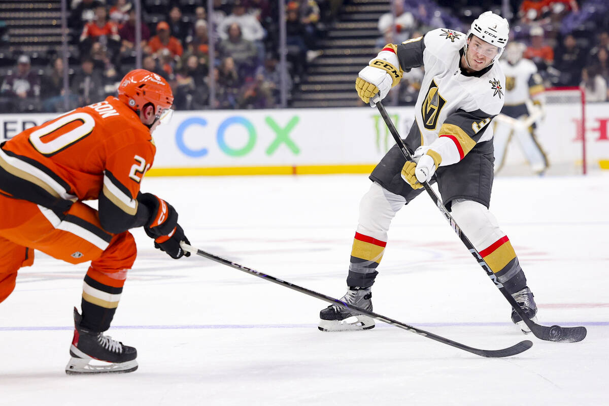 Vegas Golden Knights defenseman Brayden McNabb, right, shoots against Anaheim Ducks right wing ...