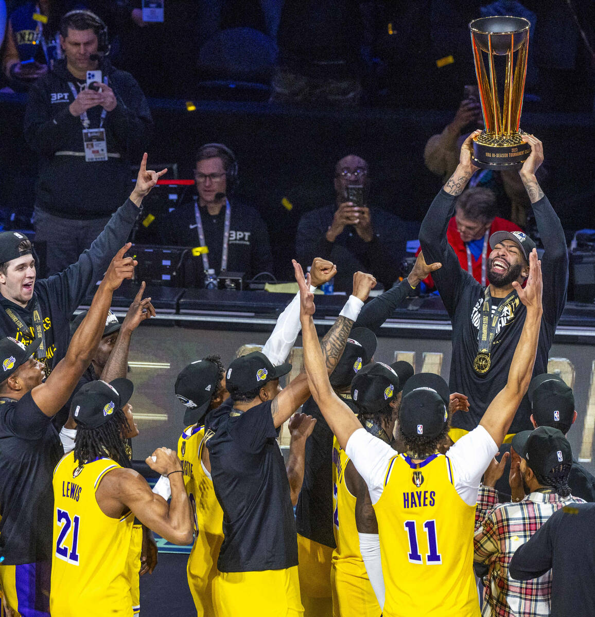 Los Angeles Lakers forward Anthony Davis (3) holds up the winning trophy about teammates after ...