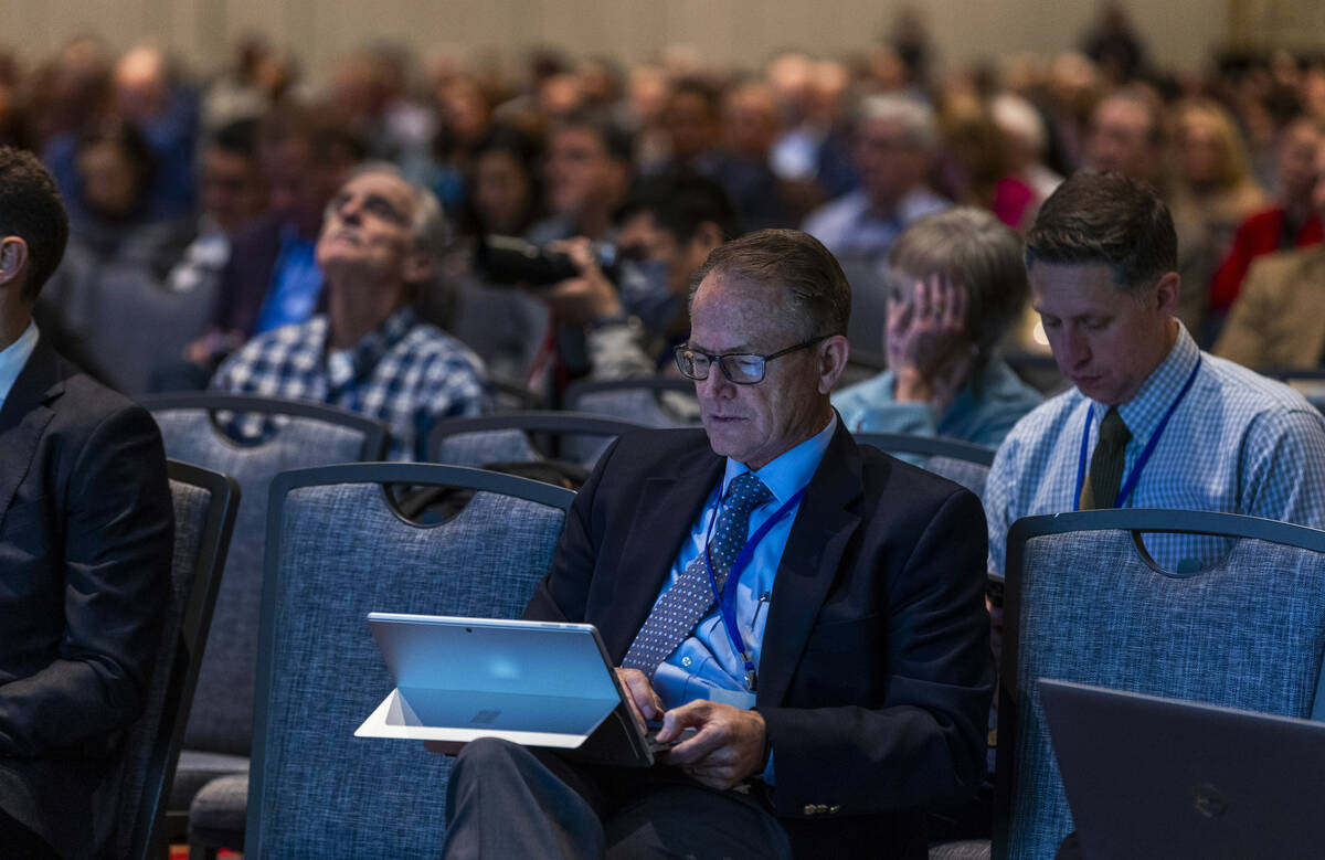 CRWUA President Gene Shawcroft takes notes as Carly Jerla with the Bureau of Reclamation gives ...