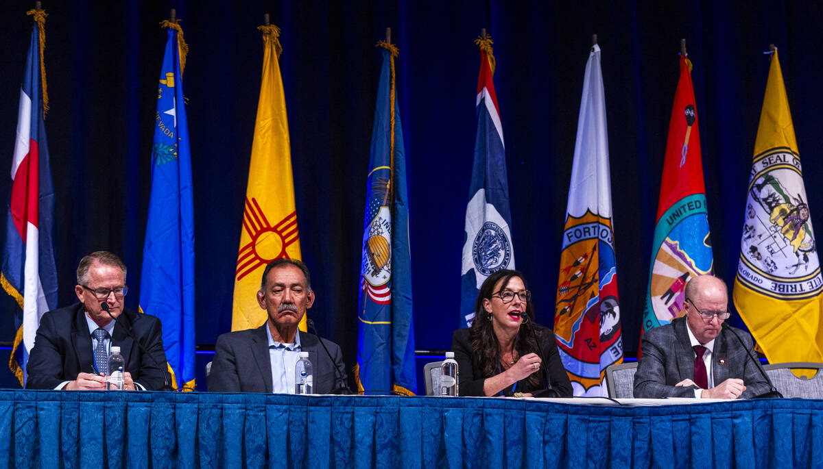 (From left) Gene Shawcroft of Utah and Estevan Lopez of New Mexico look on as Becky Mitchell of ...