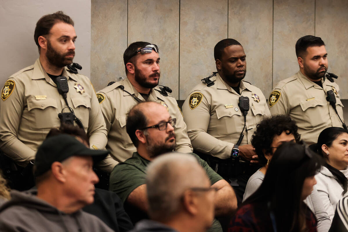 Metropolitan Police Department officers listen during a community meeting on unsafe driving and ...