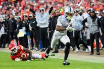 Las Vegas Raiders wide receiver Tre Tucker (11) runs in for a touchdown after Kansas City Chief ...