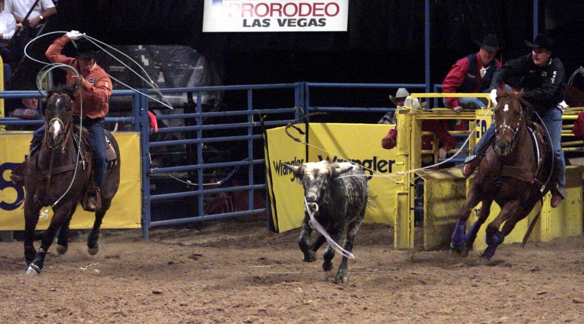 Rich Skelton and header Speed Williams work their steer during ninth go-round team roping actio ...