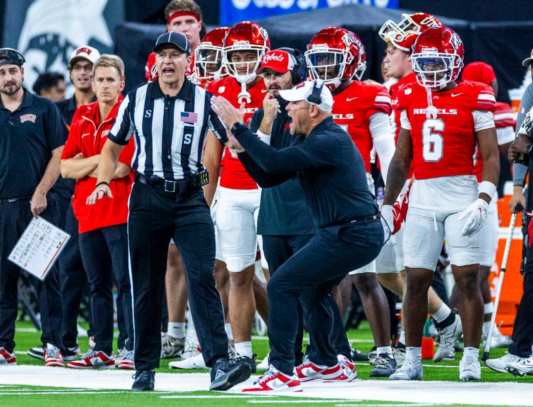 UNLV head coach Barry Odom emphasizes his point to a sideline referee against the Boise State B ...