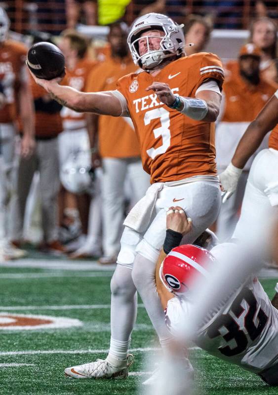 Texas quarterback Quinn Ewers (3) is sacked by Georgia linebacker Chaz Chambliss (32) during th ...