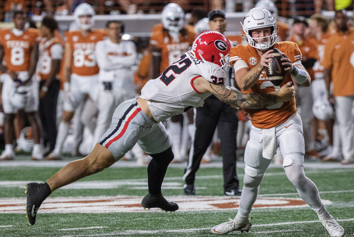 Texas quarterback Quinn Ewers (3) is sacked by Georgia linebacker Chaz Chambliss (32) during th ...