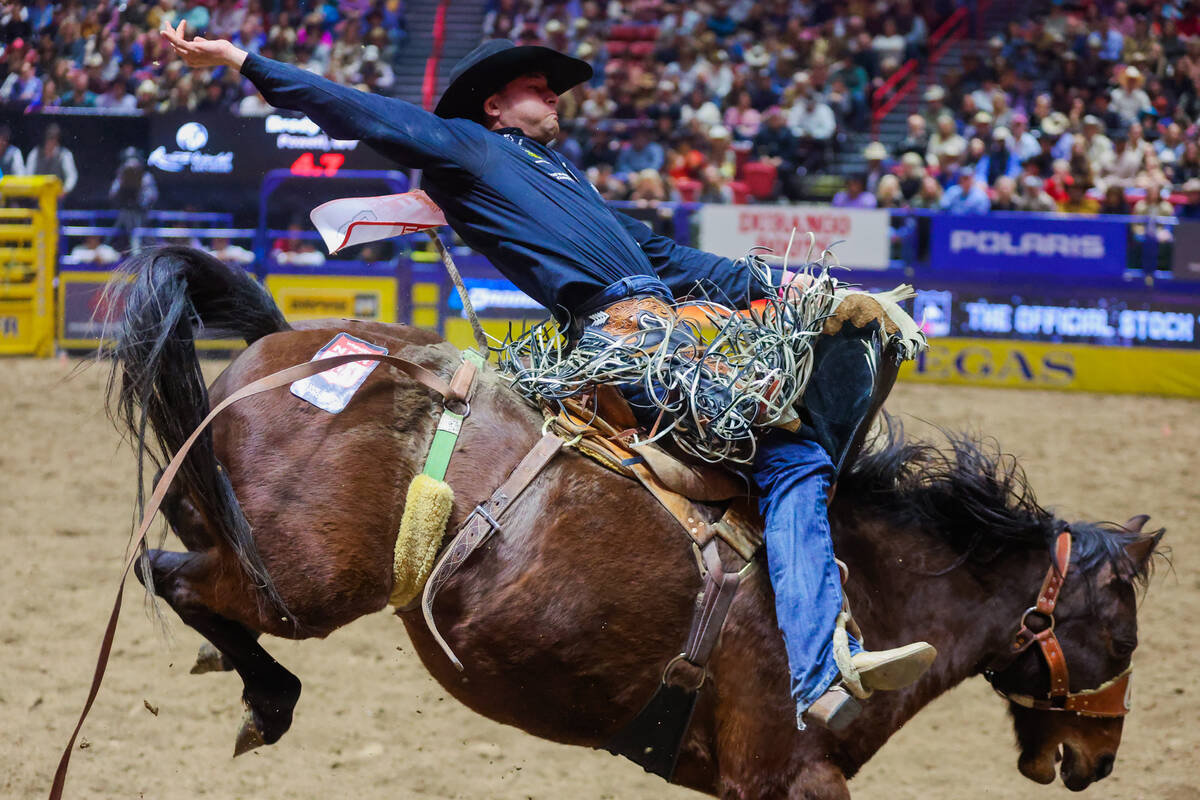 Saddle Bronc rider Brody Wells stays steady on Diamond Fever during round three of the National ...