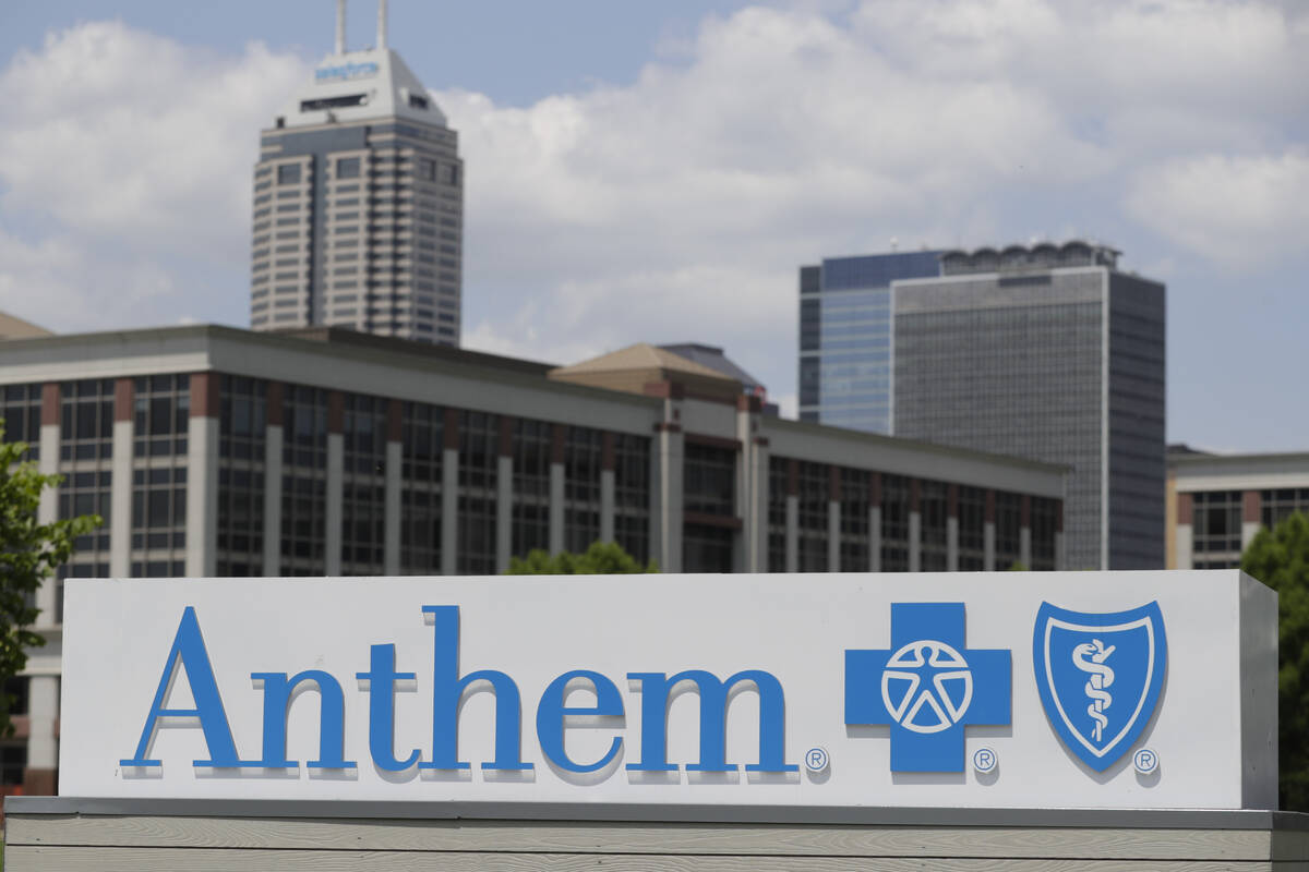 Signage is displayed the outside of the corporate headquarters building of health insurance com ...