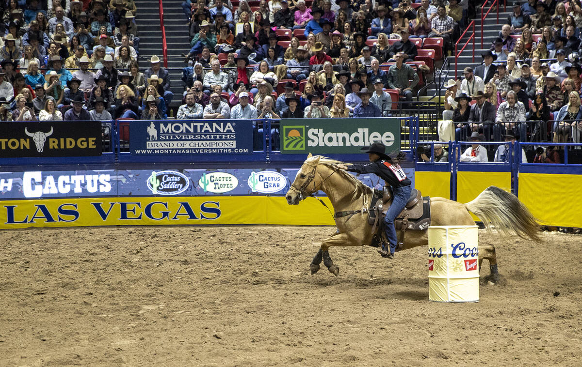 Hailey Kinsel competes in the barrel racing event during opening night of the National Finals R ...