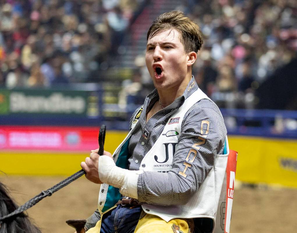 Weston Timberman takes a victory lap after winning the bareback riding event during opening nig ...