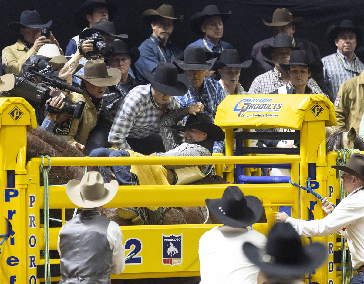 Weston Timberman prepares in the chute before competing in the bareback riding event during ope ...