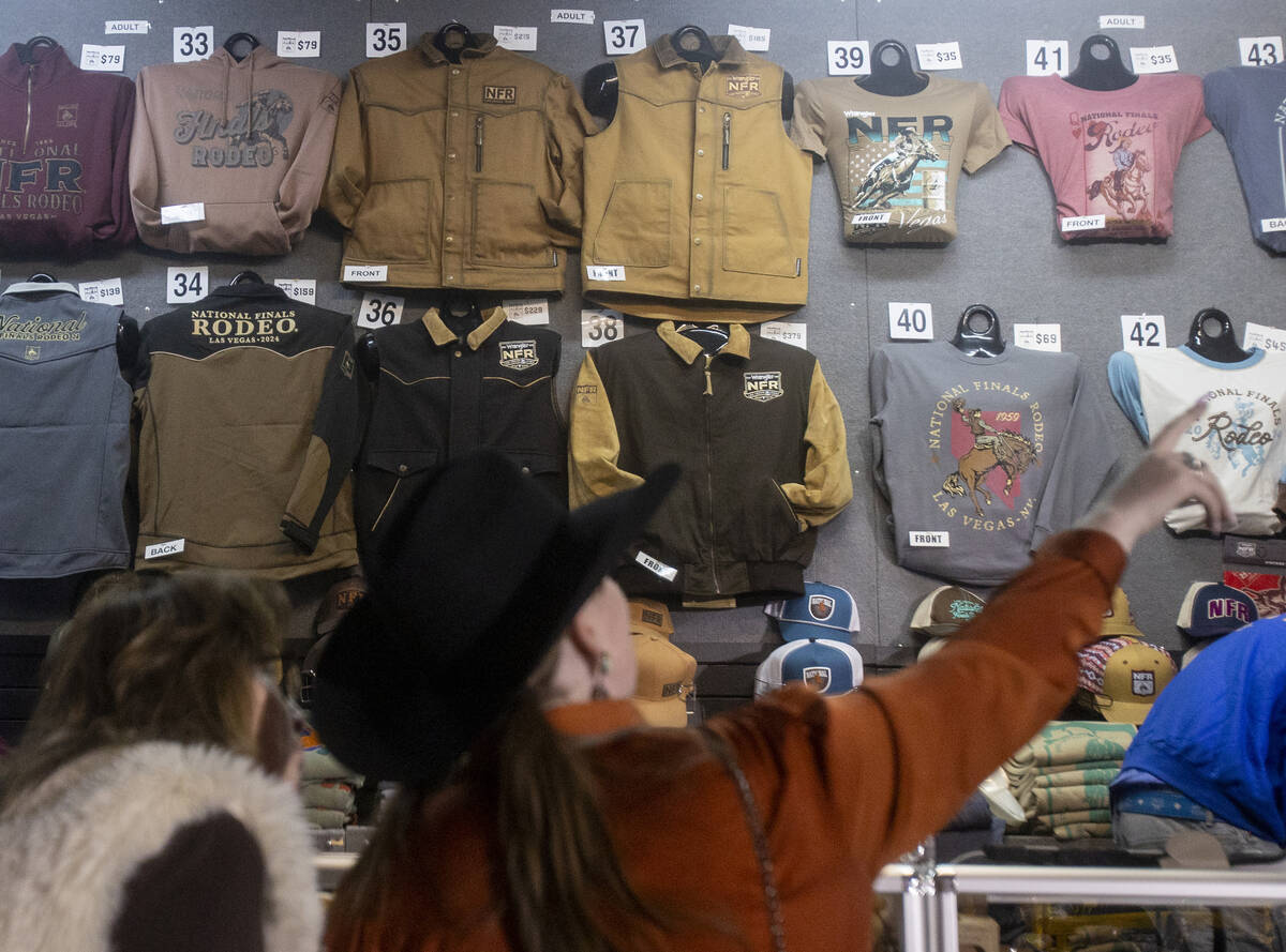 Attendees look through merchandise before opening night of the National Finals Rodeo outside th ...