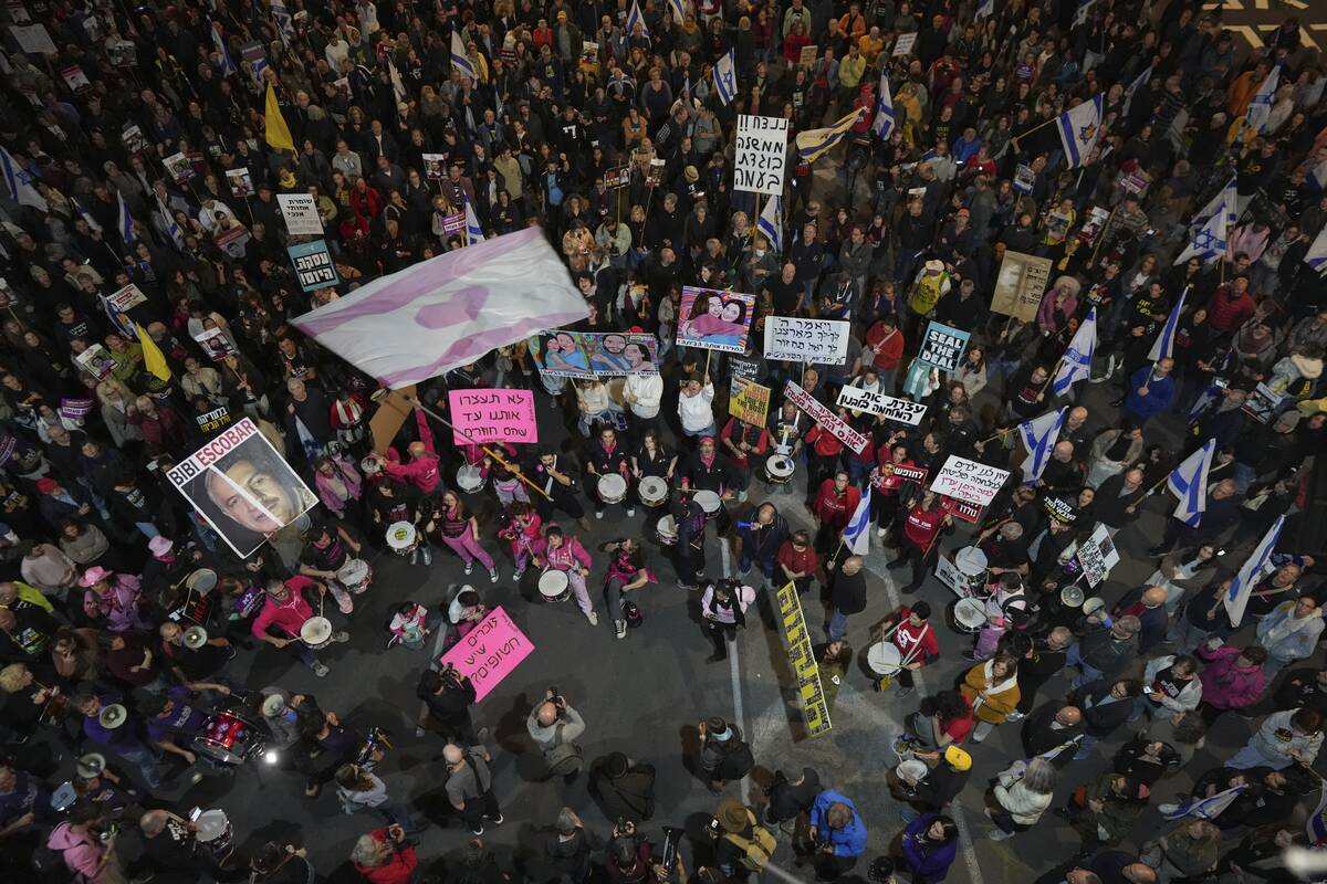 People shout slogans during a protest against Prime Minister Benjamin Netanyahu's government an ...