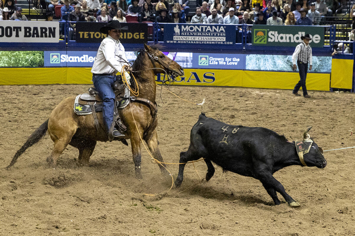 Wesley Thorp competes in the team roping event during opening night of the National Finals Rode ...