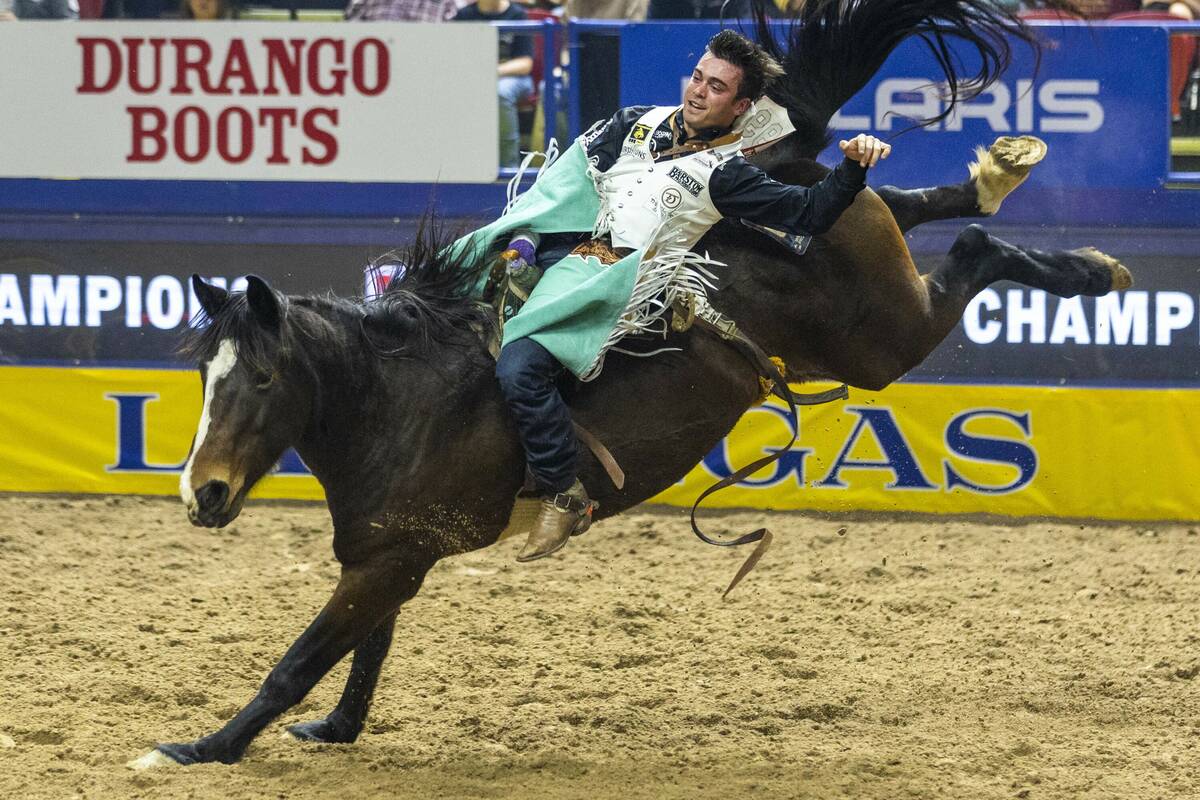 Bareback rider Bradlee Miller rides True Grit to a winning time during National Finals Rodeo Da ...