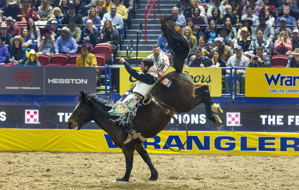 Bareback rider Bradlee Miller rides True Grit to a winning time during National Finals Rodeo Da ...